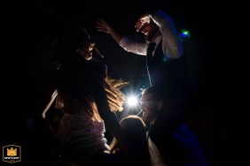 Backlit party dance scene at Parada Uno in Funes, Rosario, Santa Fe, dramatically illuminated to highlight the power of light.